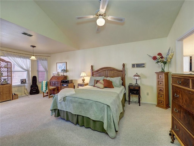 bedroom featuring ceiling fan, light carpet, and vaulted ceiling