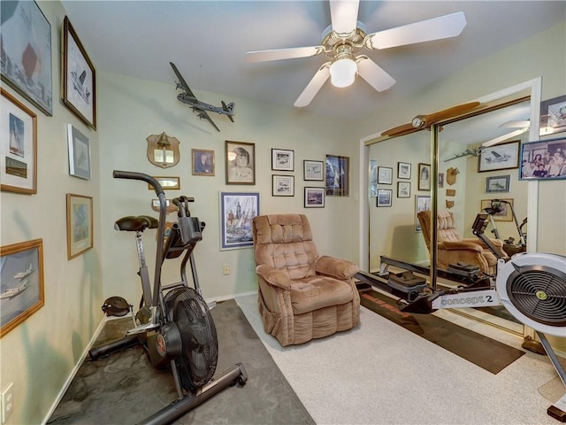 exercise area featuring carpet flooring and ceiling fan