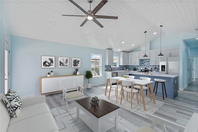 living room featuring ceiling fan, high vaulted ceiling, light hardwood / wood-style flooring, and wooden ceiling