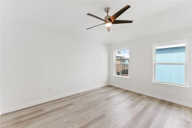 empty room with ceiling fan and light wood-type flooring