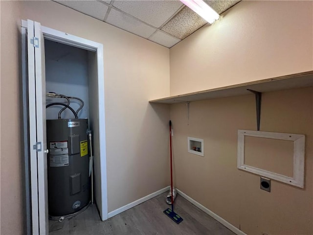 laundry room with electric water heater, hardwood / wood-style flooring, hookup for an electric dryer, and washer hookup