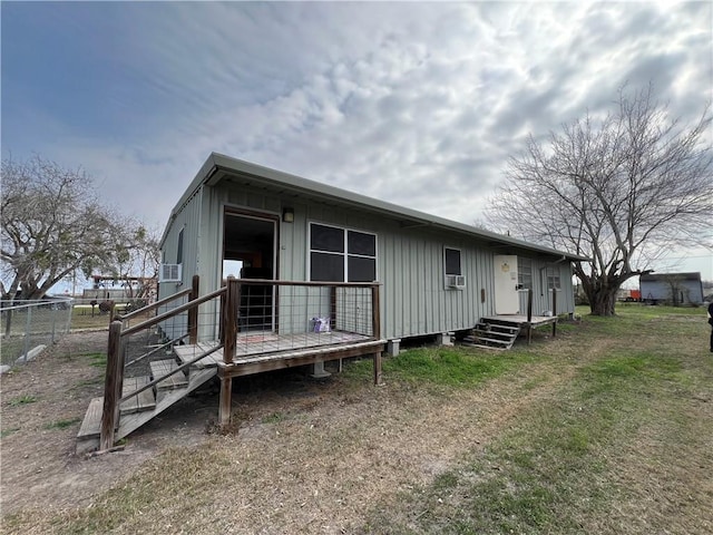 back of property with a yard and cooling unit