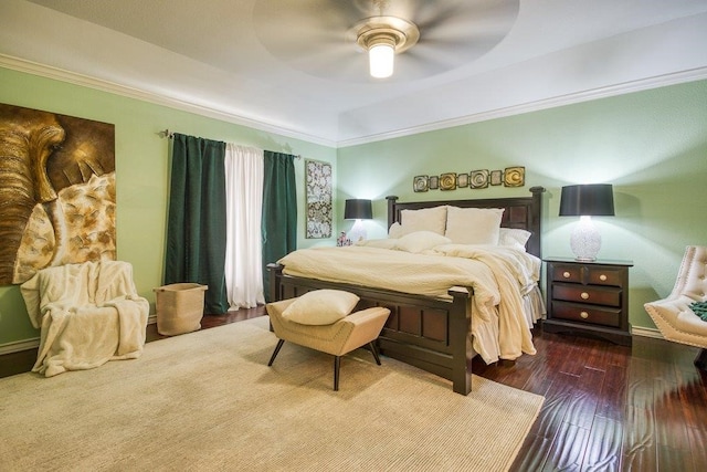 bedroom with a ceiling fan, crown molding, and wood finished floors