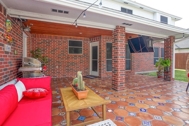 view of patio featuring grilling area and visible vents