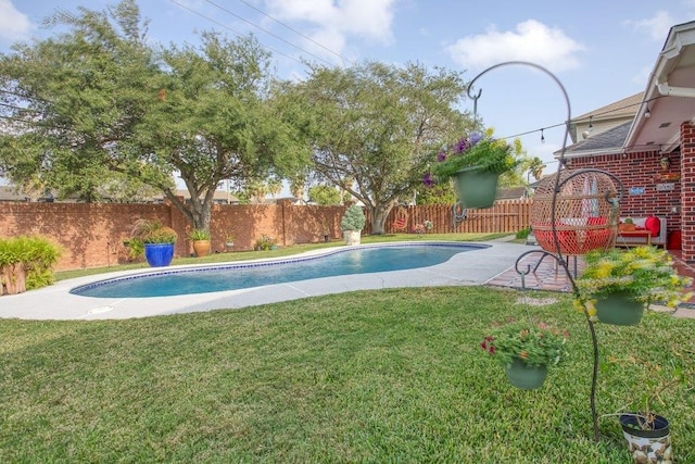 view of pool with a lawn, a patio area, a fenced backyard, and a fenced in pool