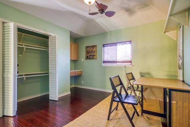 office area featuring ceiling fan, wood finished floors, lofted ceiling, and baseboards