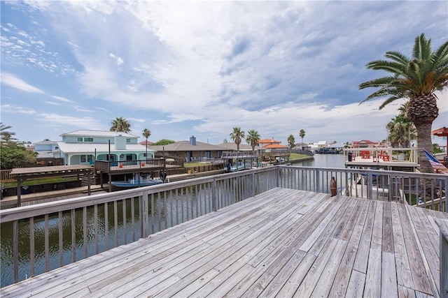 view of dock featuring a deck with water view