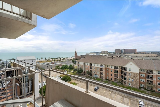 balcony with a water view and a city view