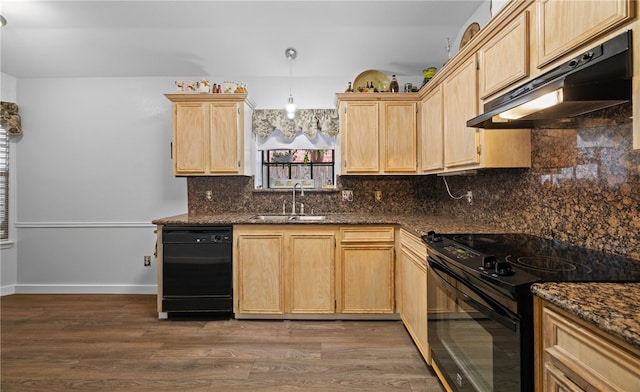 kitchen featuring black appliances, light brown cabinetry, hanging light fixtures, sink, and dark wood-type flooring