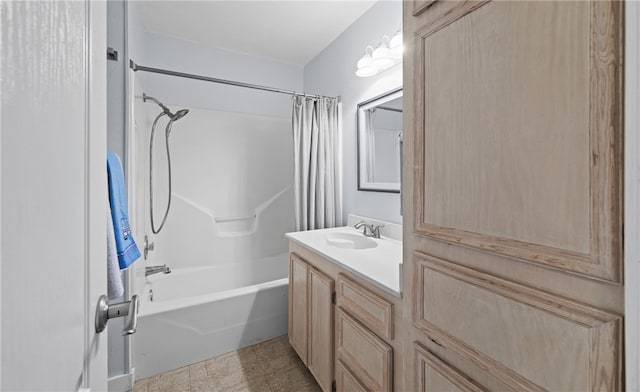 bathroom featuring vanity and shower / bathtub combination with curtain