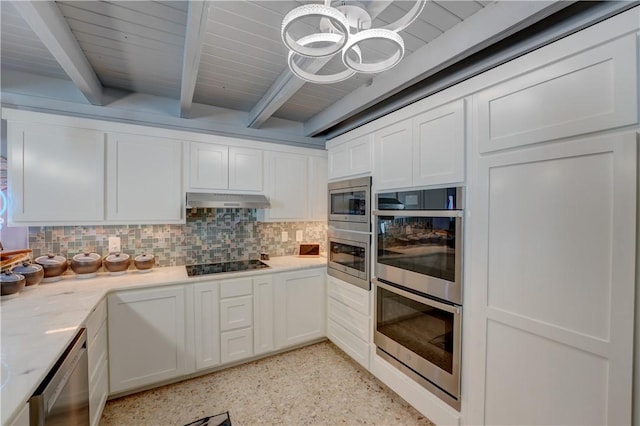 kitchen featuring stainless steel appliances, white cabinetry, and backsplash