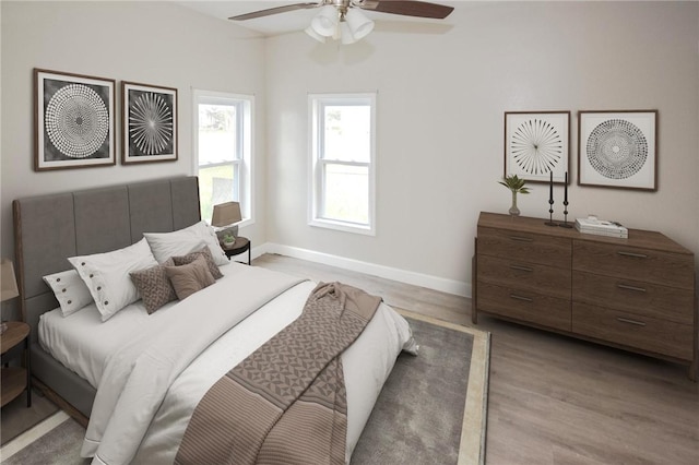 105 E Cornwall St, Rockport, TX 78382 - bedroom with wood finished floors, baseboards, and a ceiling fan