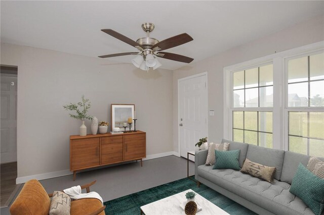 105 E Cornwall St, Rockport, TX 78382 - living area featuring baseboards and a ceiling fan