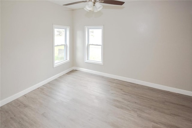 105 E Cornwall St, Rockport, TX 78382 - empty room with ceiling fan, wood finished floors, and baseboards