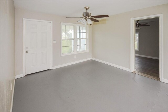 105 E Cornwall St, Rockport, TX 78382 - unfurnished room featuring finished concrete flooring, a ceiling fan, and baseboards