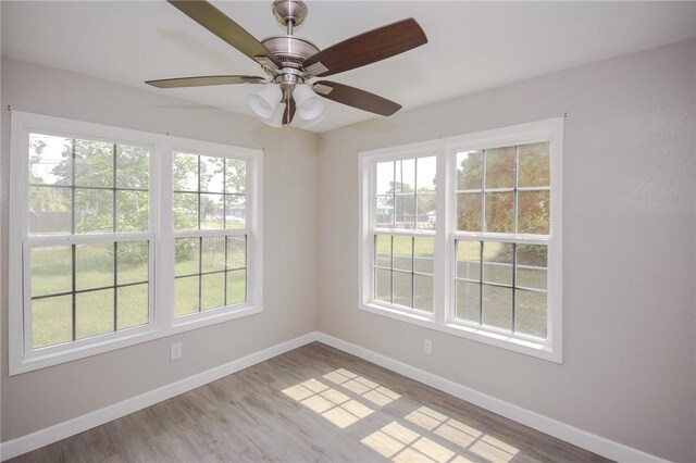 105 E Cornwall St, Rockport, TX 78382 - spare room with healthy amount of natural light and baseboards