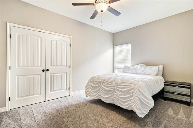 carpeted bedroom with baseboards, ceiling fan, and a closet