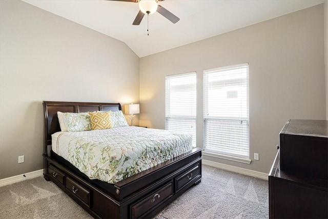 bedroom with a ceiling fan, baseboards, light carpet, and lofted ceiling