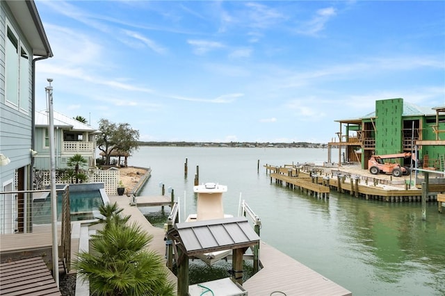 view of dock with boat lift and a water view