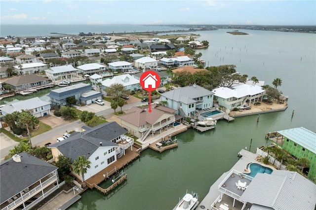 bird's eye view with a residential view and a water view