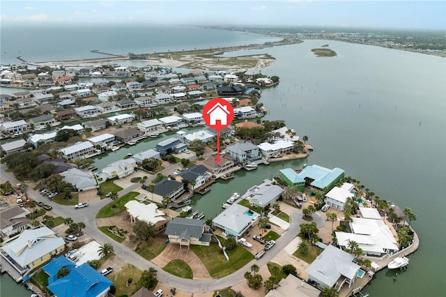 birds eye view of property featuring a residential view and a water view