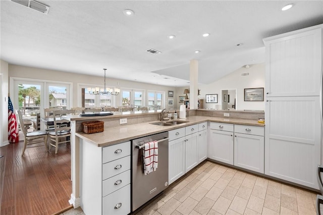 kitchen with visible vents, a healthy amount of sunlight, dishwasher, and a sink