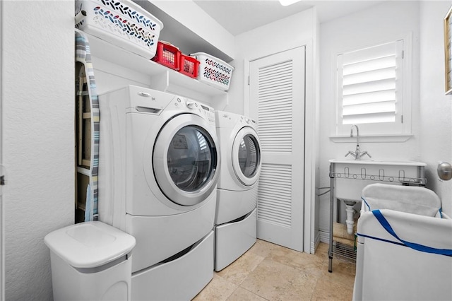 clothes washing area with laundry area and washing machine and clothes dryer