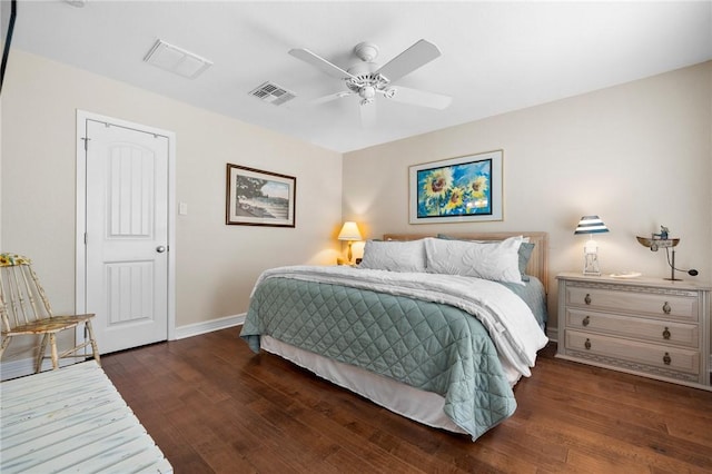 bedroom featuring ceiling fan, visible vents, baseboards, and wood finished floors