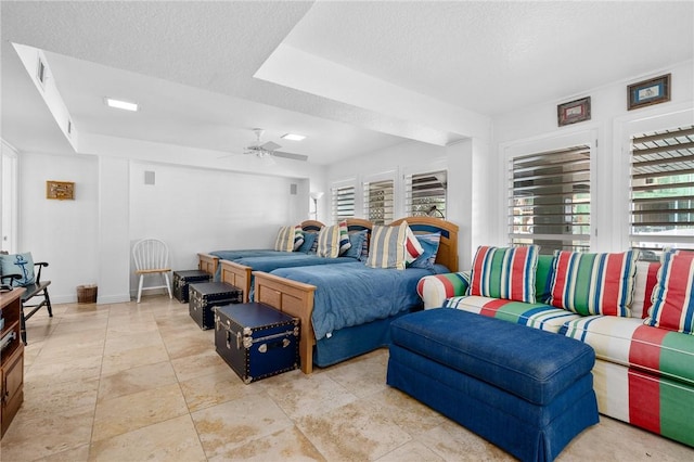 bedroom with visible vents, baseboards, a textured ceiling, and ceiling fan