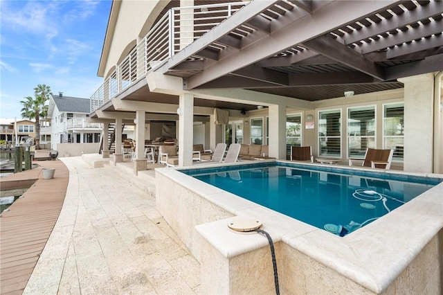 pool featuring a patio and a pergola