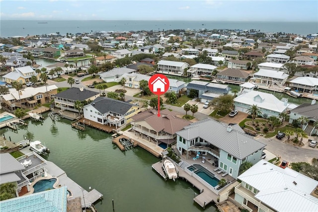 bird's eye view featuring a residential view and a water view