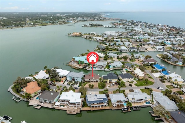 bird's eye view featuring a residential view and a water view