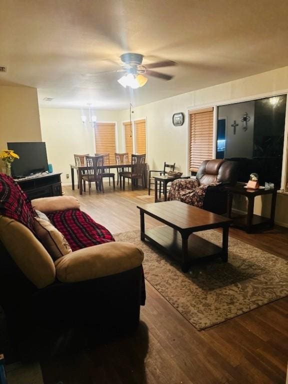 living room featuring ceiling fan and wood-type flooring