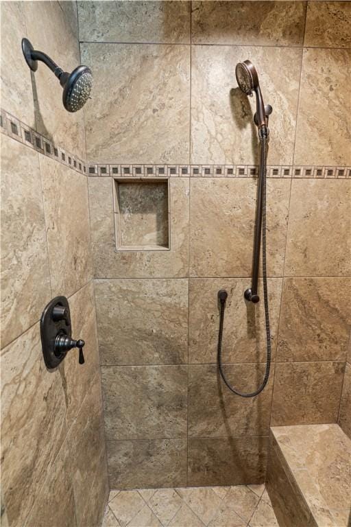 full bath with a tile shower