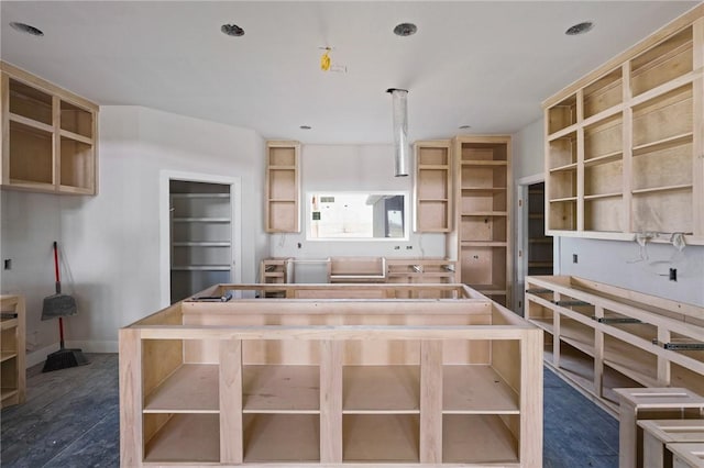 kitchen featuring open shelves, decorative light fixtures, and baseboards