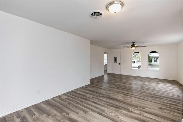 unfurnished living room with ceiling fan and hardwood / wood-style floors