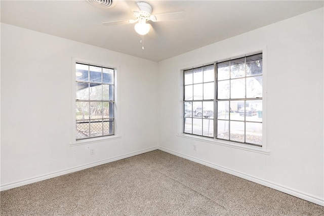 empty room with ceiling fan and carpet flooring