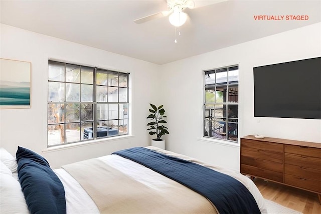 bedroom featuring ceiling fan and wood-type flooring