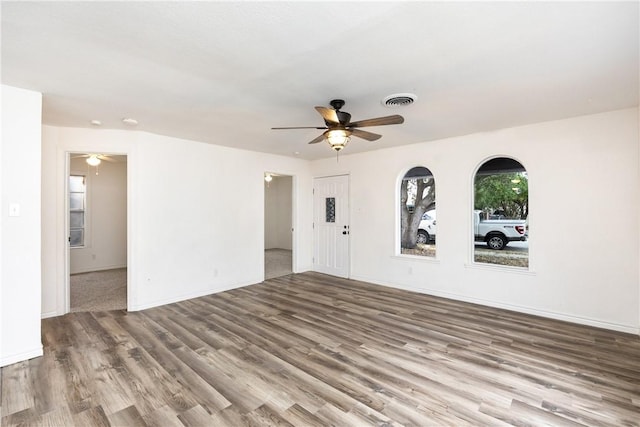 spare room featuring hardwood / wood-style flooring and ceiling fan