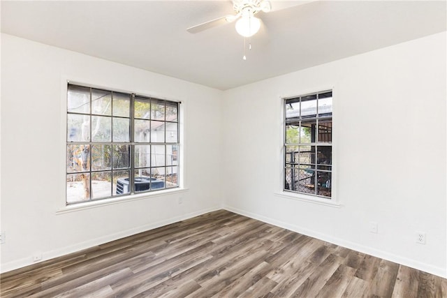 spare room with ceiling fan and hardwood / wood-style floors