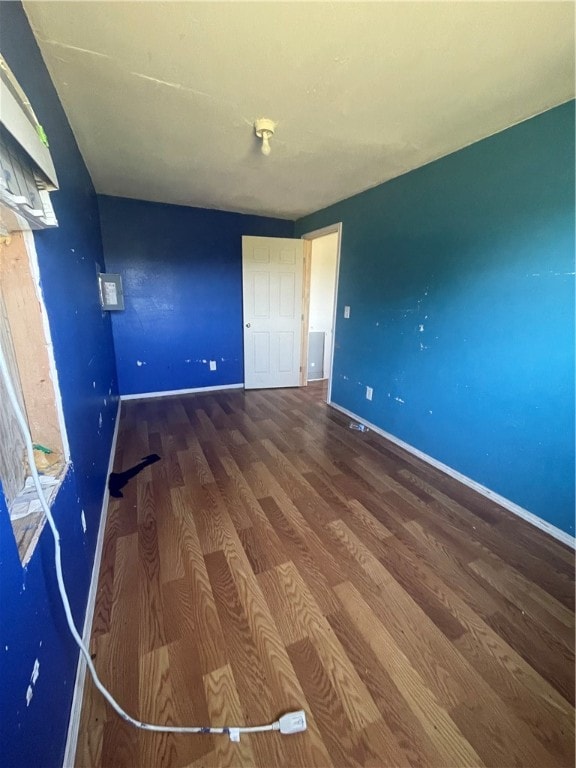 spare room with hardwood / wood-style floors