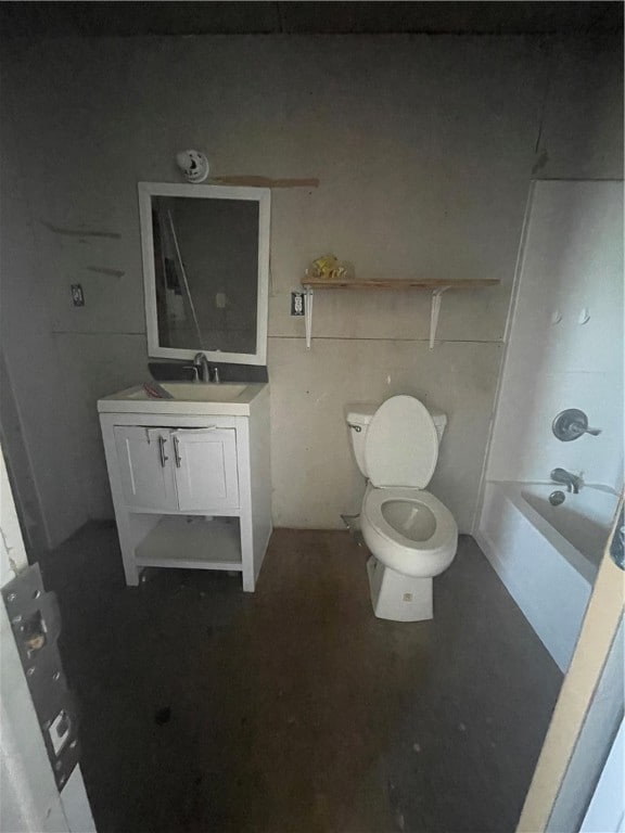 full bathroom featuring washtub / shower combination, vanity, and toilet