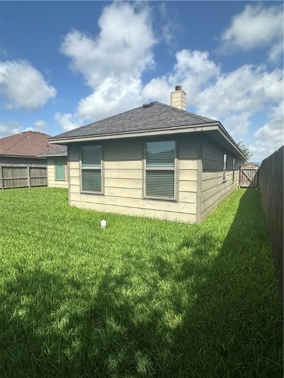 2818 Lake Rhapsody Dr, Corpus Christi, TX 78414 - view of property exterior featuring a fenced backyard, a chimney, and a shingled roof