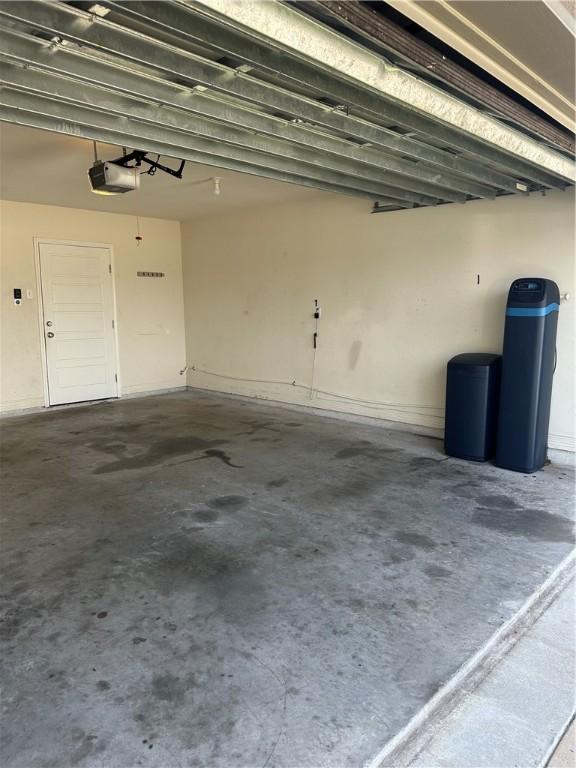 2818 Lake Rhapsody Dr, Corpus Christi, TX 78414 - garage featuring a garage door opener