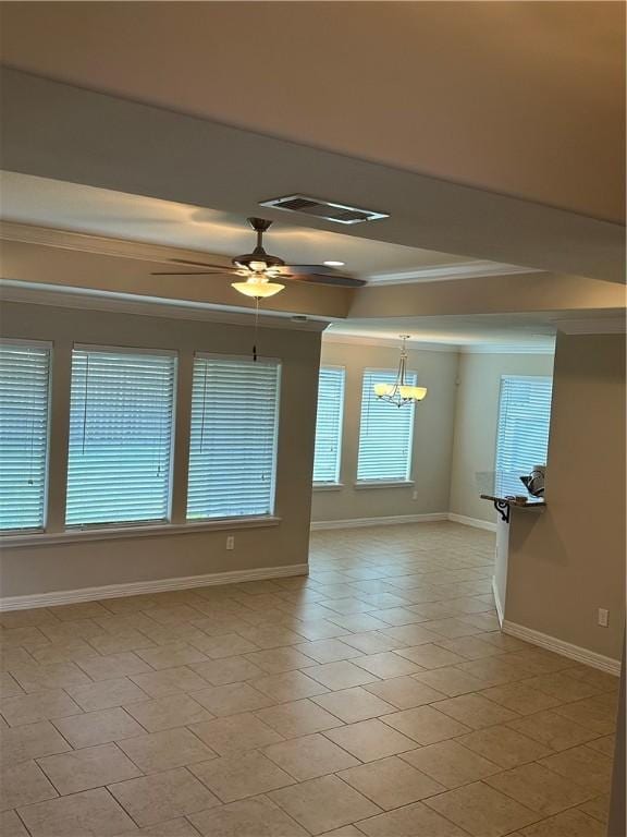 2818 Lake Rhapsody Dr, Corpus Christi, TX 78414 - empty room with crown molding, a tray ceiling, a chandelier, a ceiling fan, and light tile patterned flooring