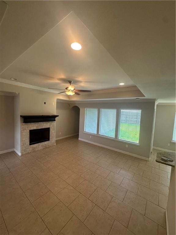 2818 Lake Rhapsody Dr, Corpus Christi, TX 78414 - unfurnished living room with a ceiling fan, ornamental molding, a fireplace, recessed lighting, and light tile patterned floors