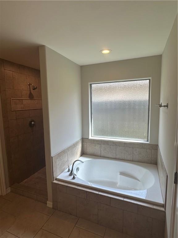 2818 Lake Rhapsody Dr, Corpus Christi, TX 78414 - bathroom with a garden tub, a tile shower, and tile patterned flooring