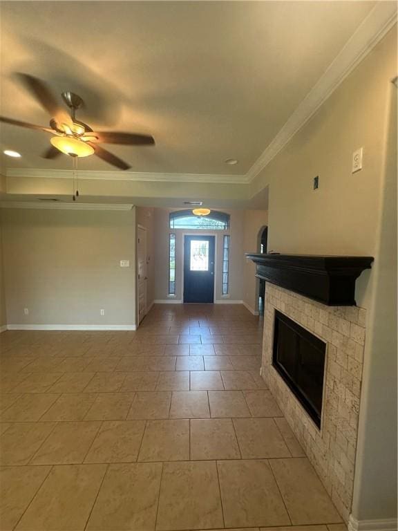 2818 Lake Rhapsody Dr, Corpus Christi, TX 78414 - foyer featuring a glass covered fireplace, crown molding, and ceiling fan