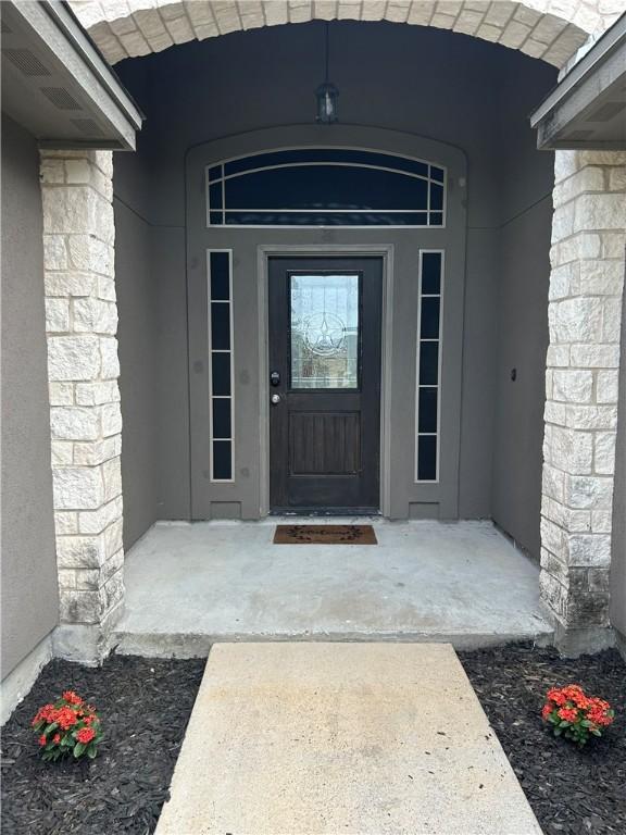 2818 Lake Rhapsody Dr, Corpus Christi, TX 78414 - doorway to property featuring stucco siding