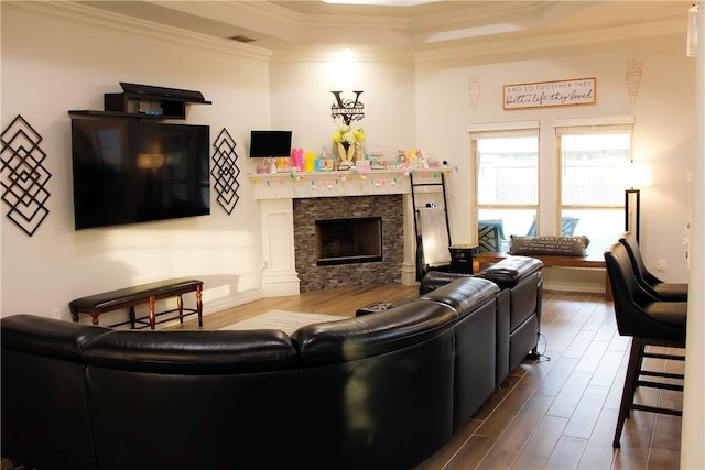 6834 Boardwalk Ave, Corpus Christi, TX 78414 - living room featuring dark wood-style flooring, a fireplace, a raised ceiling, visible vents, and ornamental molding